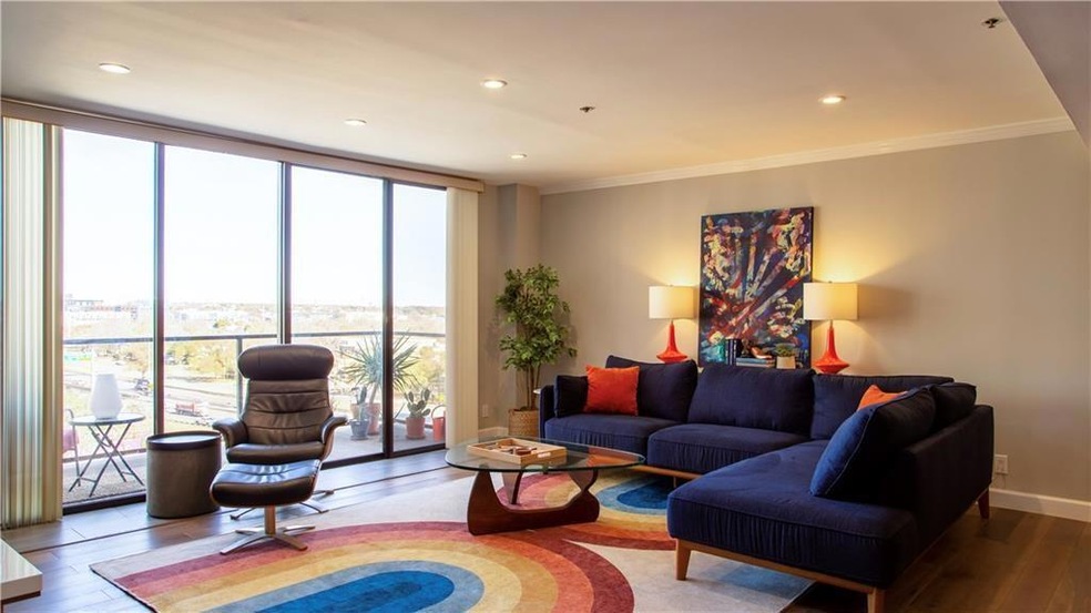 Large living room with floor-to-ceiling windows gr