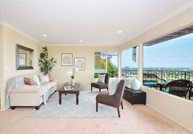 Living room on the main level with new carpeting, 