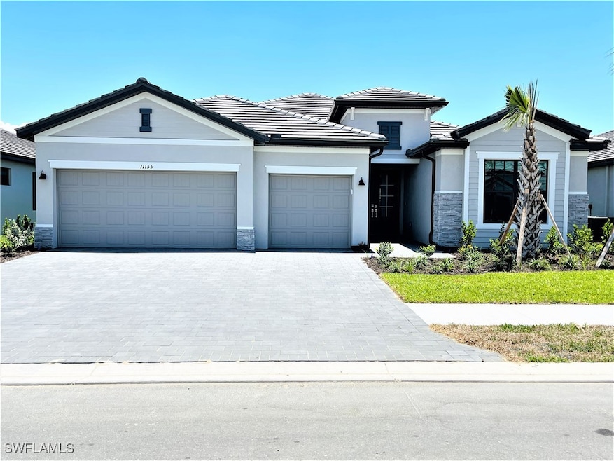 View of front facade featuring an attached garage,