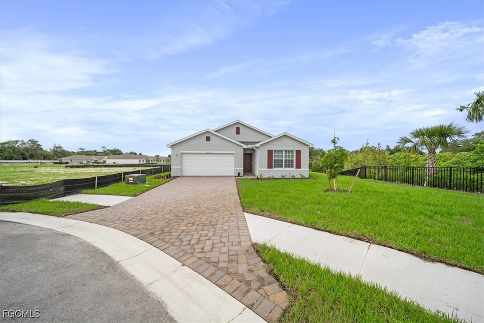 Ranch-style house with driveway and a garage