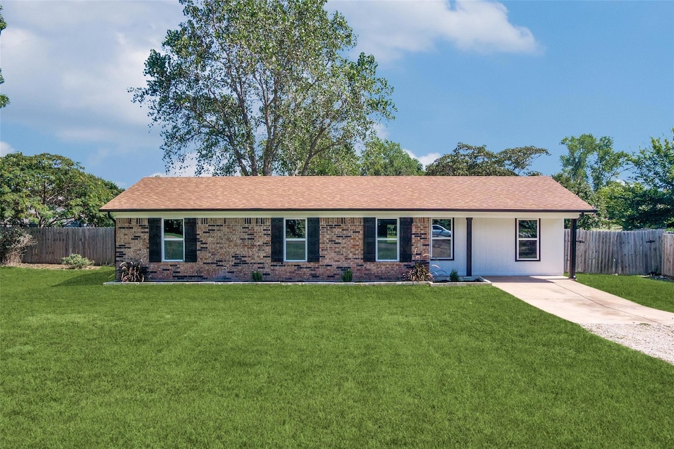 Single story home featuring a front yard