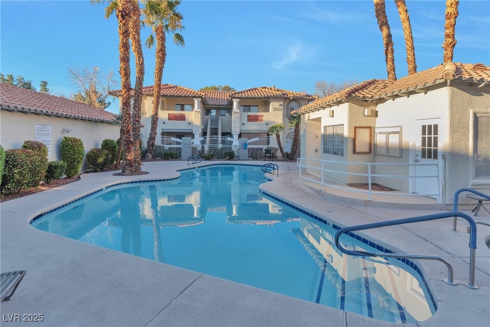 Pool featuring a patio area and a residential view
