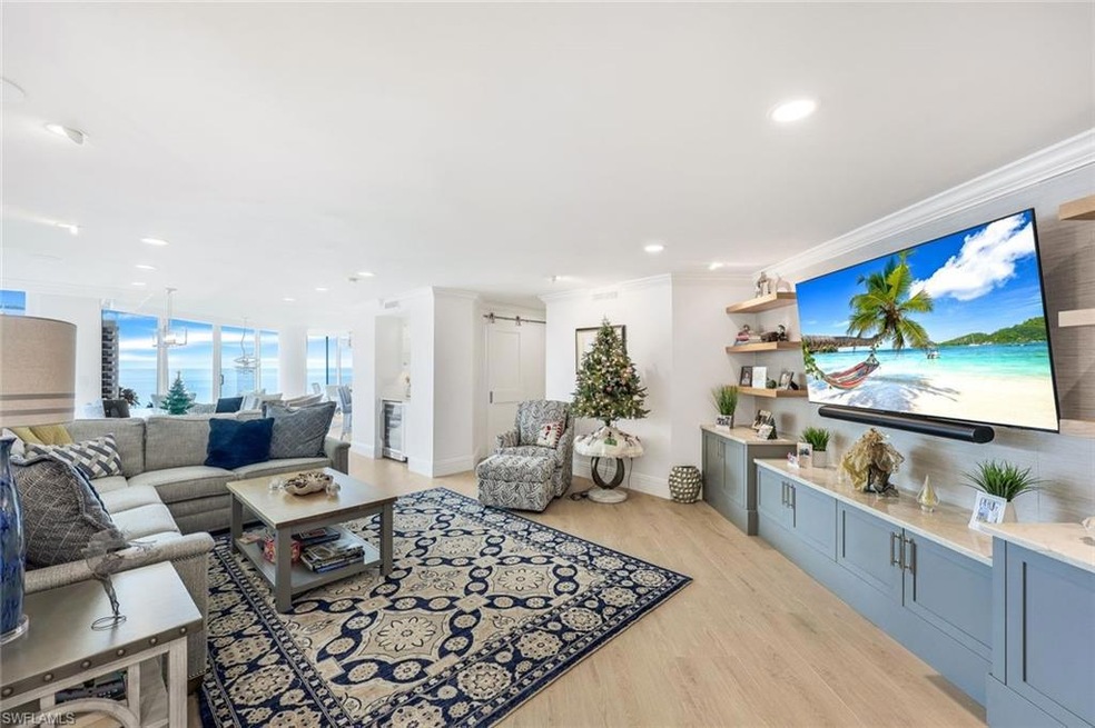 Living room with light hardwood / wood-style floor