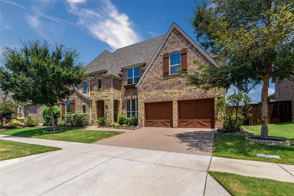 View of front of home featuring a garage and a fro