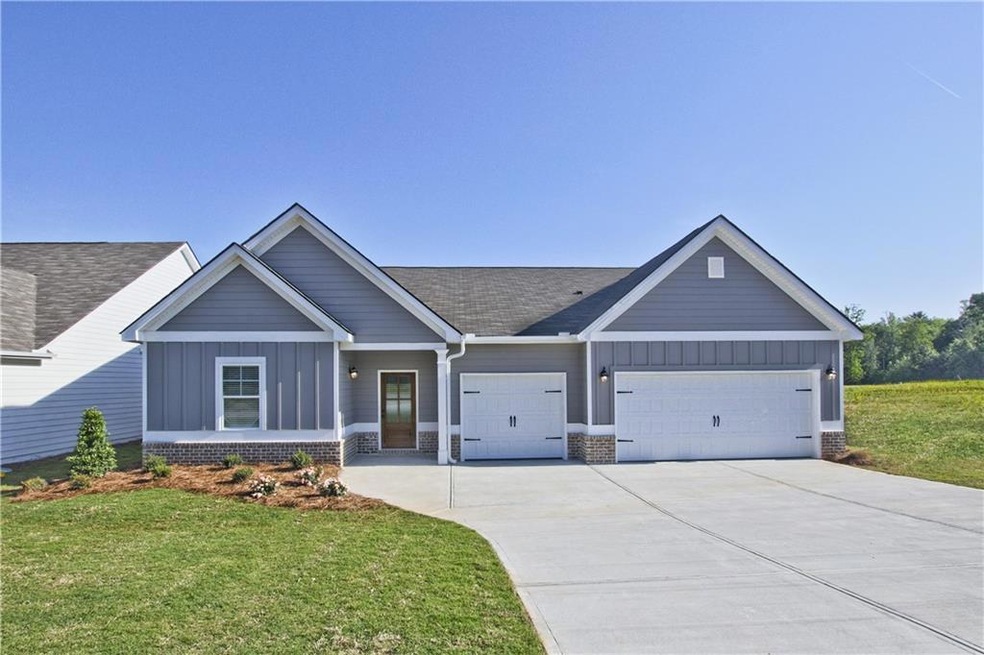 Craftsman-style house with a garage and a front la