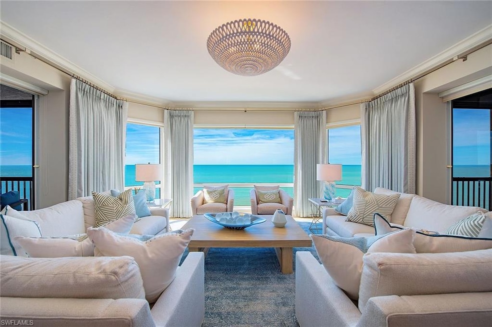 Living room featuring a water view and ornamental molding