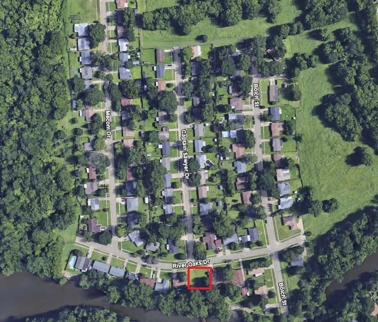 Aerial view of property's location featuring property parcel outlined