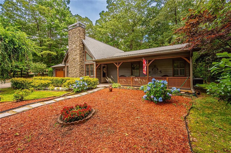 Front of house with covered porch, large rock chim