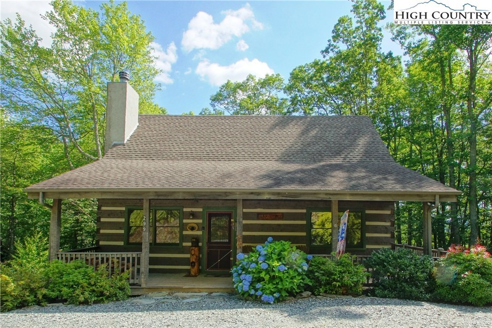 Perfect mountain log cabin with beautiful landscaping