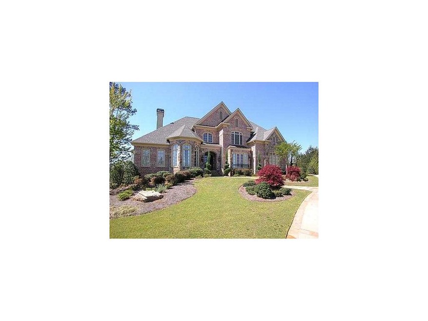 Exterior Front. Stone and brick MASTERPIECE on lar