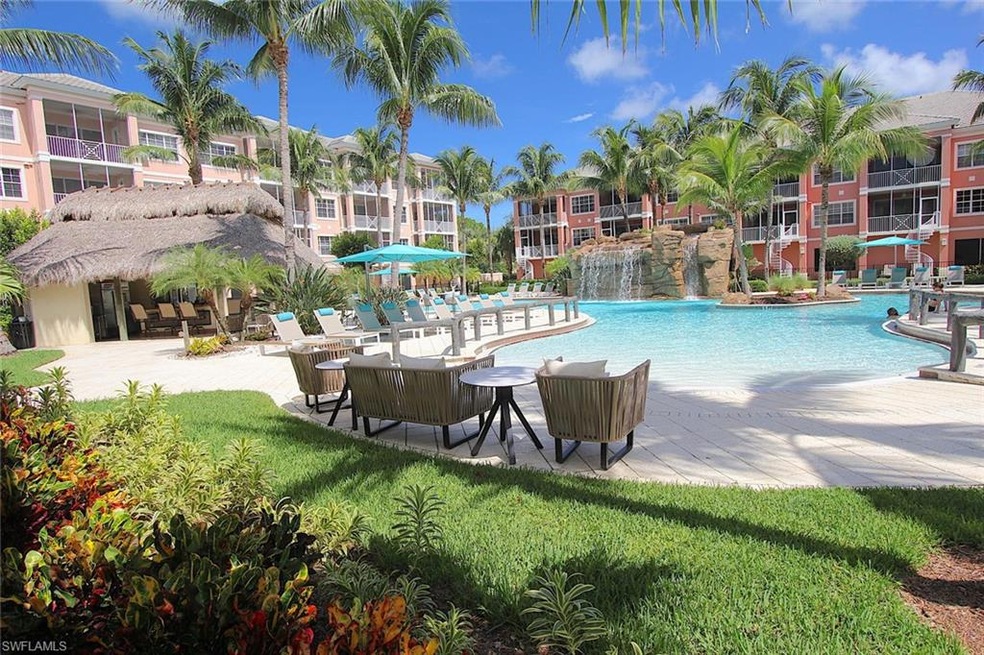 View of swimming pool with a lawn and pool water f