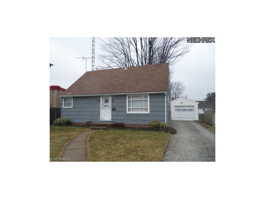 Front view of home with detached garage