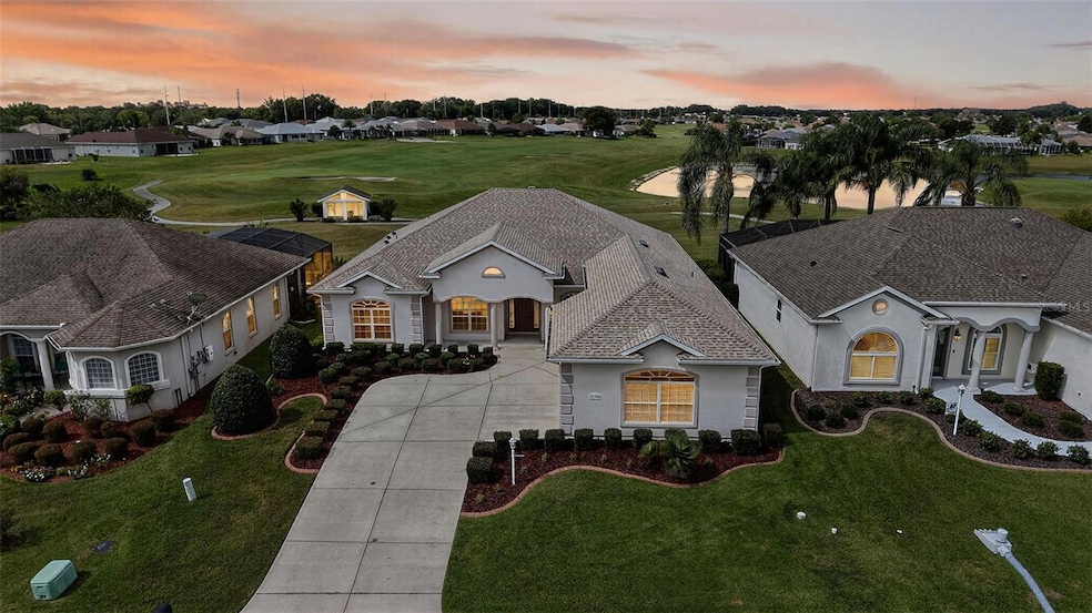 Twilight Aerial Front Elevation with Golf and Water Views