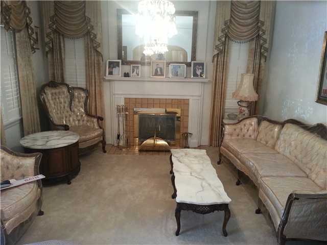 Formal Living room w/fireplace. Nice area to enjoy