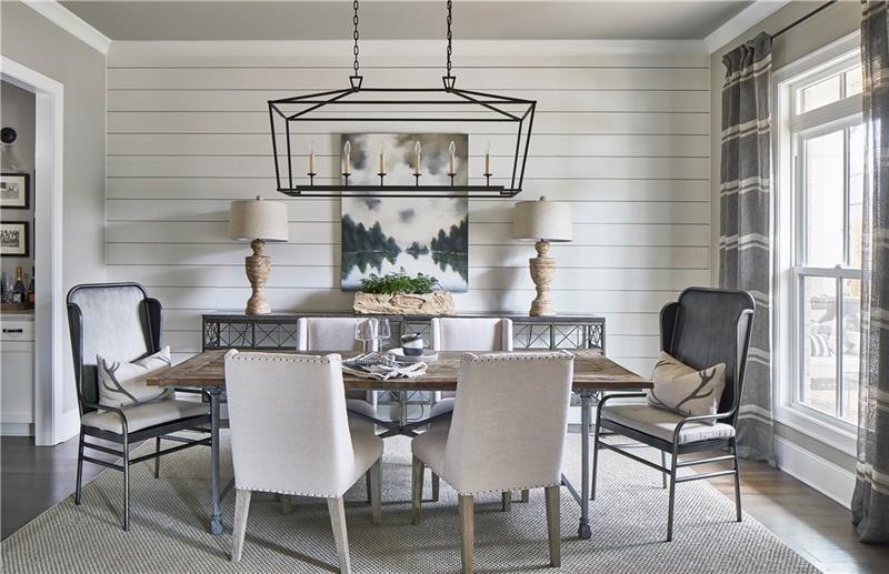 Beautiful dining room with shiplap accent and acce