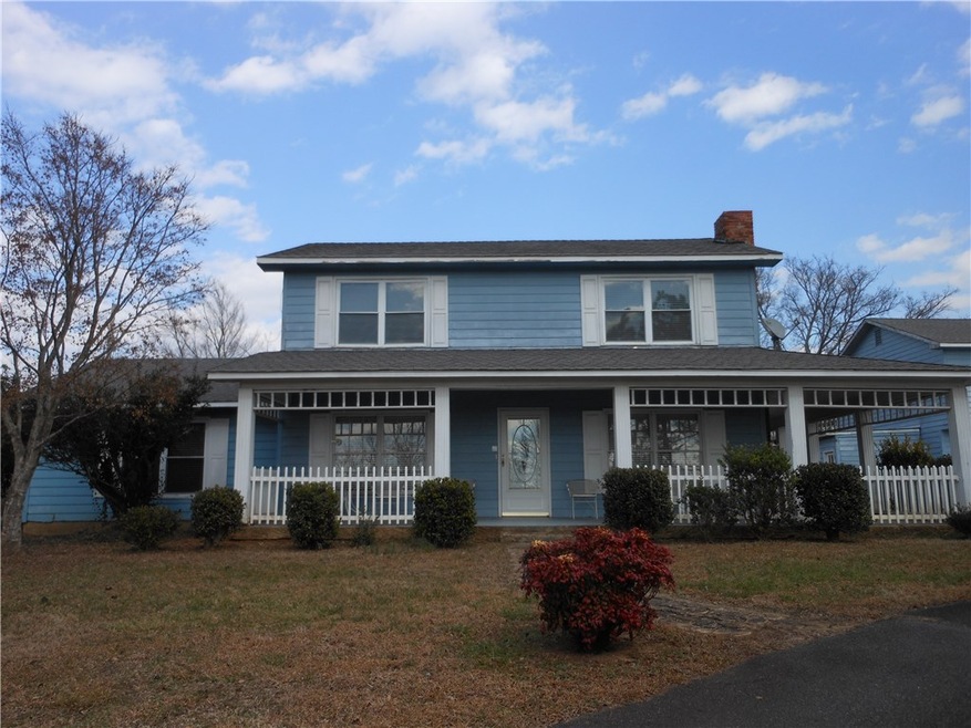 This lovely two story home sits on 6.21 acres with