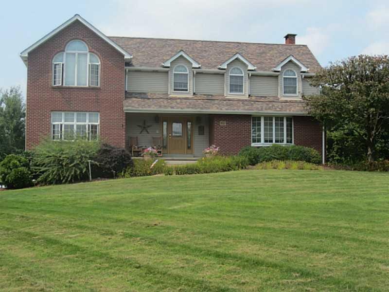 Exterior Front. Beautiful home with mature landsca