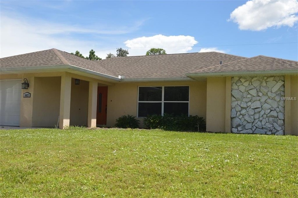 1027 Tropical Ave NW, Port Charlotte, FL 33948 - photo 1