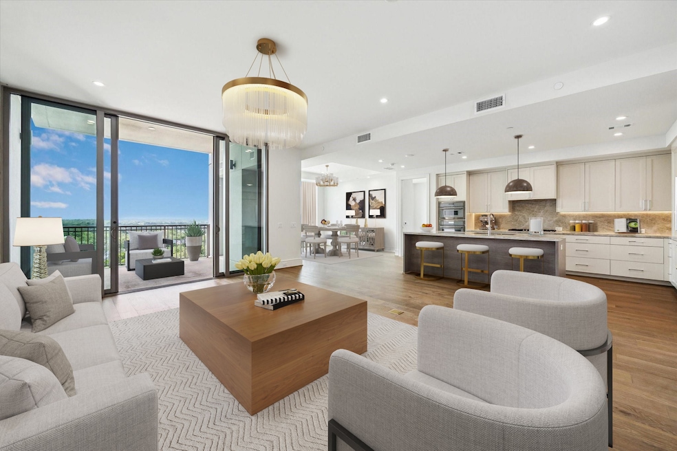 A stunning 13th floor unit with spectacular North views located within the luxury Hawthorne at Tanglewood High-rise building.  Living & dining combination creating open and connected spaces that flows effortlessly.  Photo is virtually staged