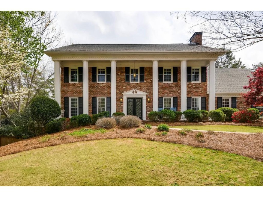 Gracious Georgian Colonial perches gently above st