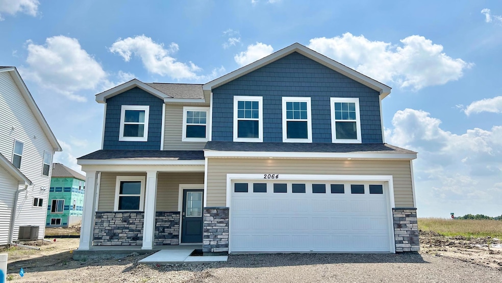 Welcome home to 2064 Aquarius Drive. Stunning curb appeal with soaring roof lines, stonework, charming front porch and more! Driveway, sod, irrigation, landscape and trees included with home. Visit today!