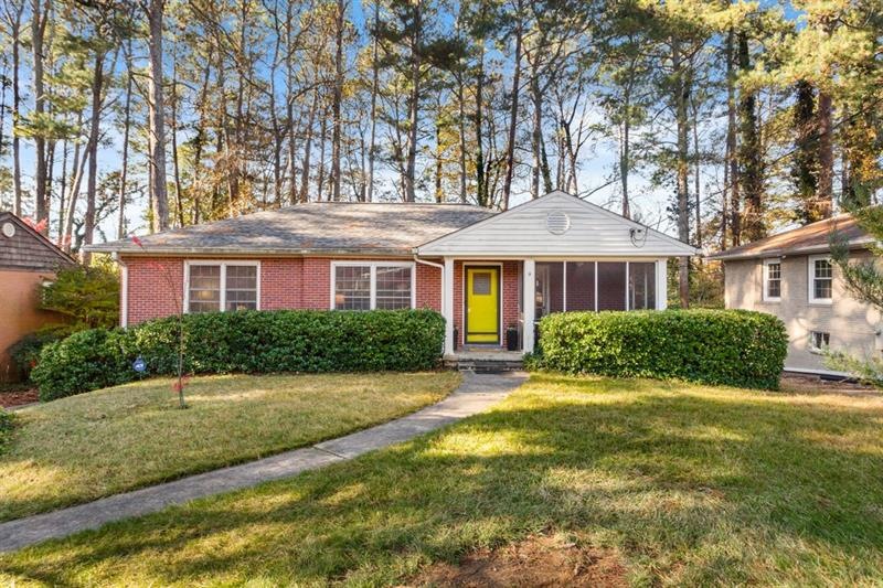 Four sided brick with a screened front porch on th