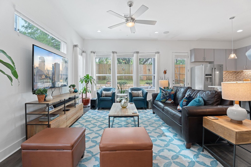 Living room featuring baseboards, wood finished f