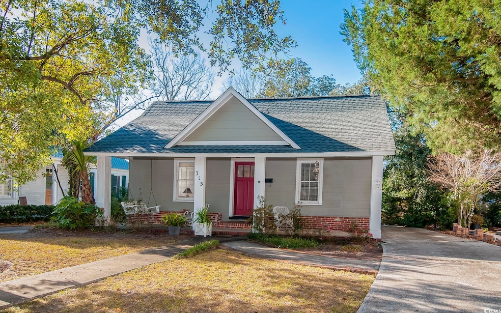 Bungalow-style house with a front lawn