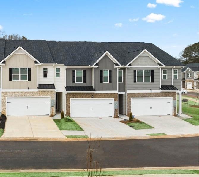 View of front of property featuring a garage