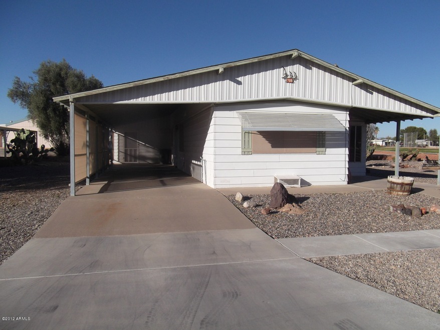 side of house with carport parking