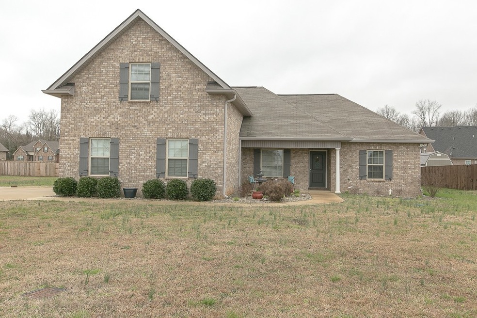 One level living brick front of home with large lot on cul de sac