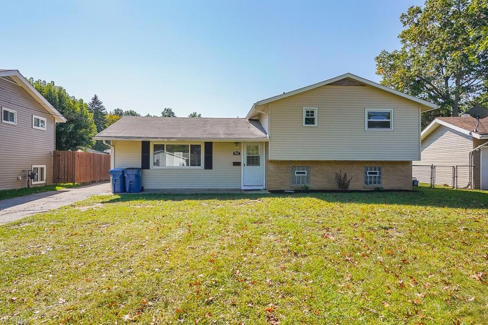 Split level home with a front yard