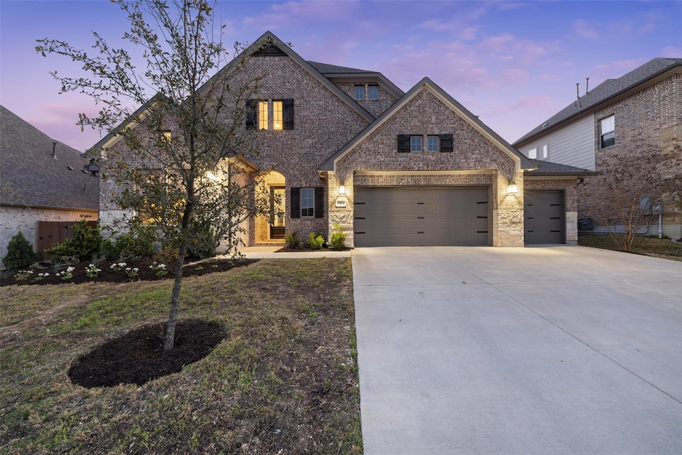 French country inspired facade with stone siding,