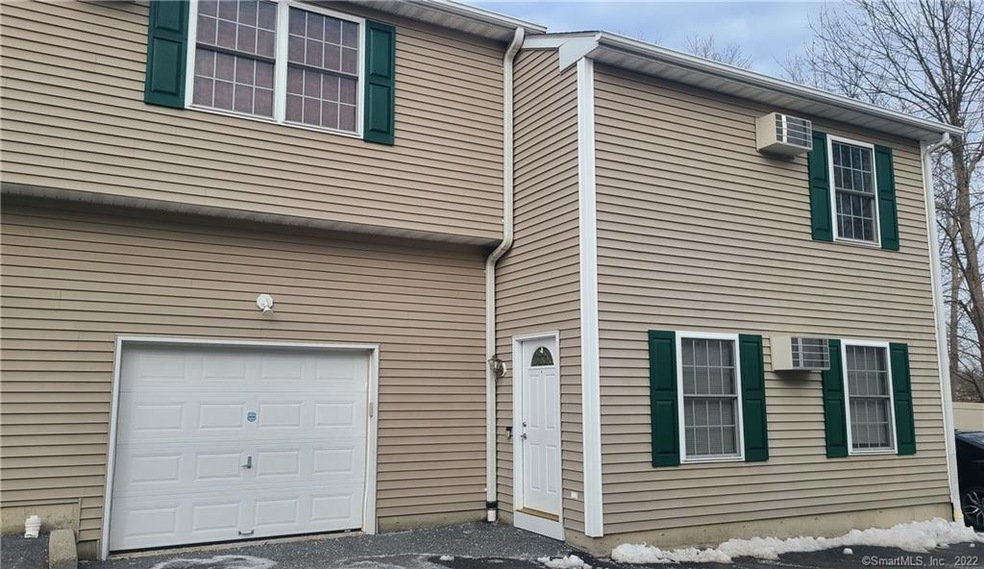 Townhouse with garage on left, connects to living 
