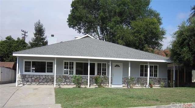 Front of home.  Driveway to the detached garage is