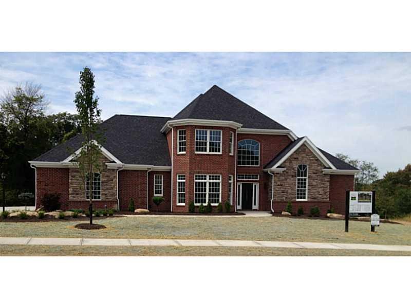 Exterior Front. Spectacular brick and stone home b