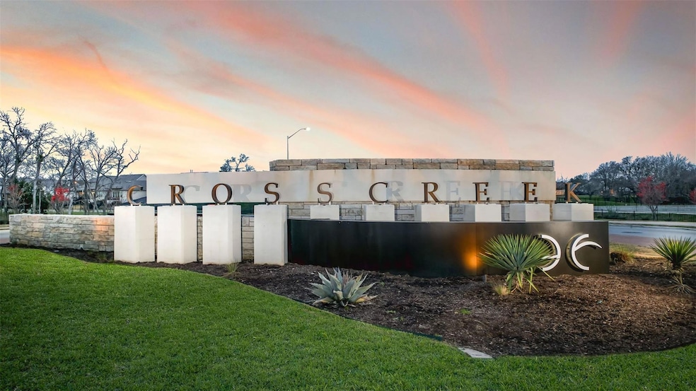 Community sign featuring a lawn