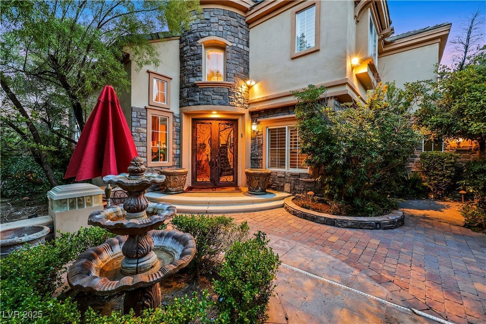 View of exterior entry featuring stone siding, fre