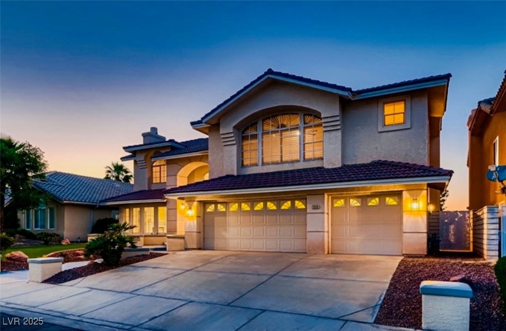 Traditional-style house featuring a garage, drivew