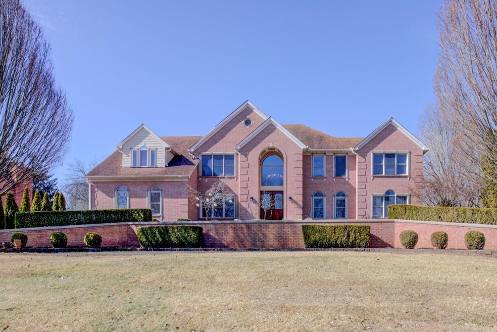 Horseshoe Driveway Frames The Front Of The House For Stately Curb Appeal!