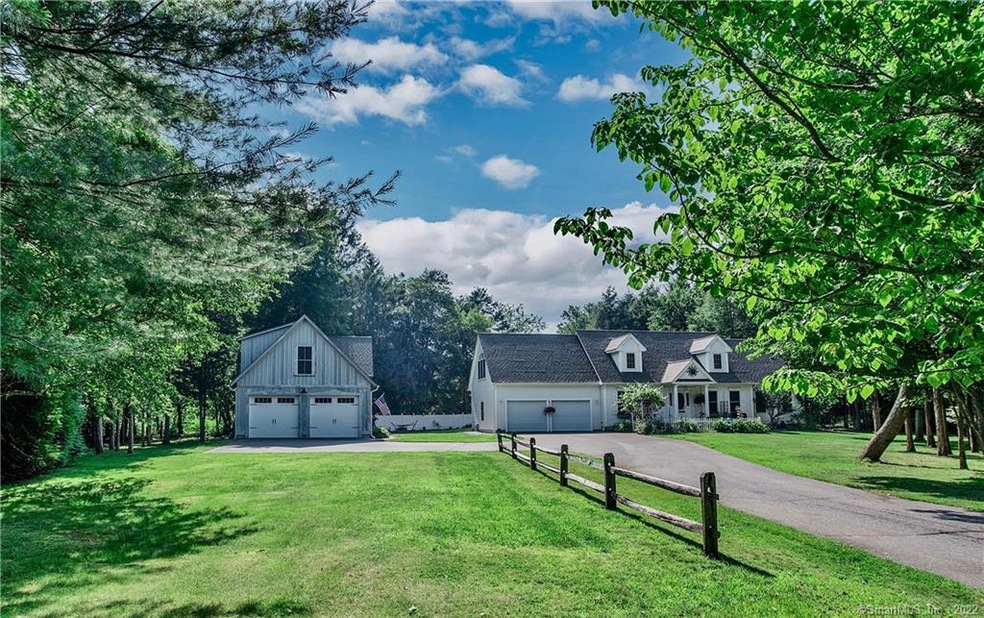 VERY privately sited. 4 garage bays.