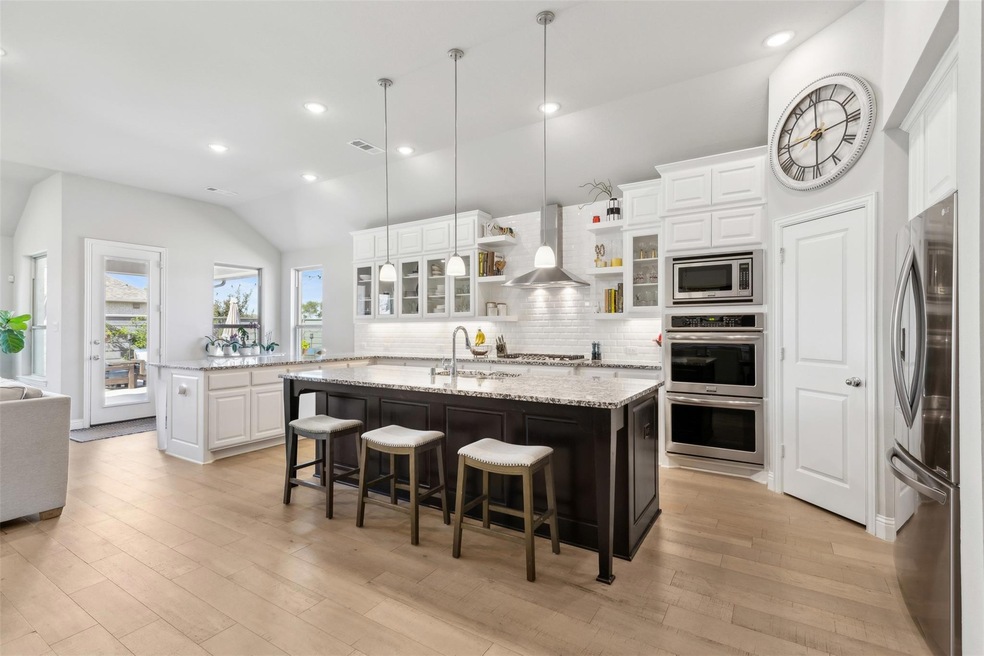 Kitchen featuring stainless steel appliances, ligh
