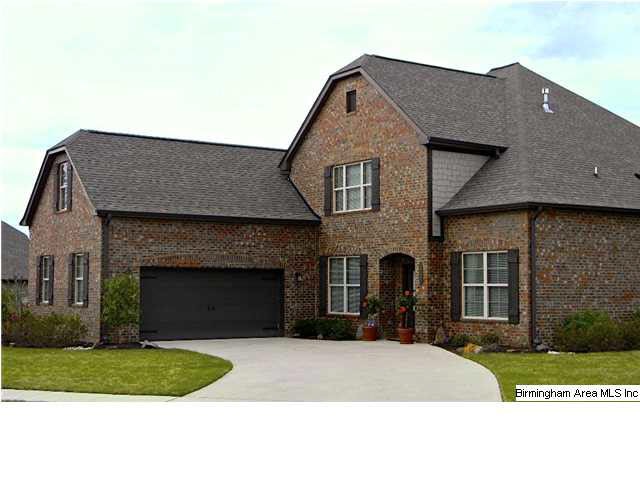 Front view of home on a wide private large lot.  T