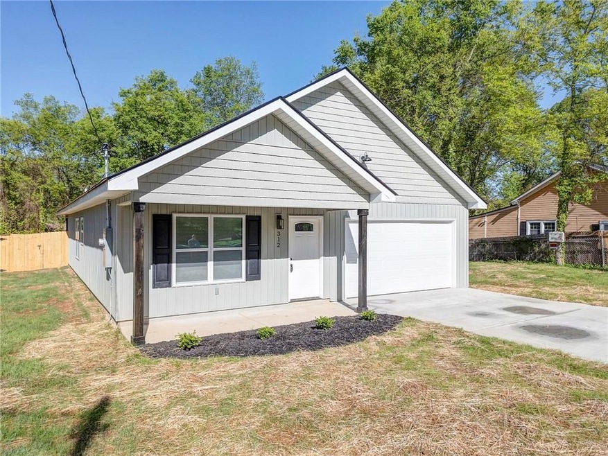 View of front of house featuring a porch and a fro