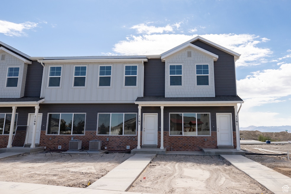 View of front of home featuring brick siding and a mountain view