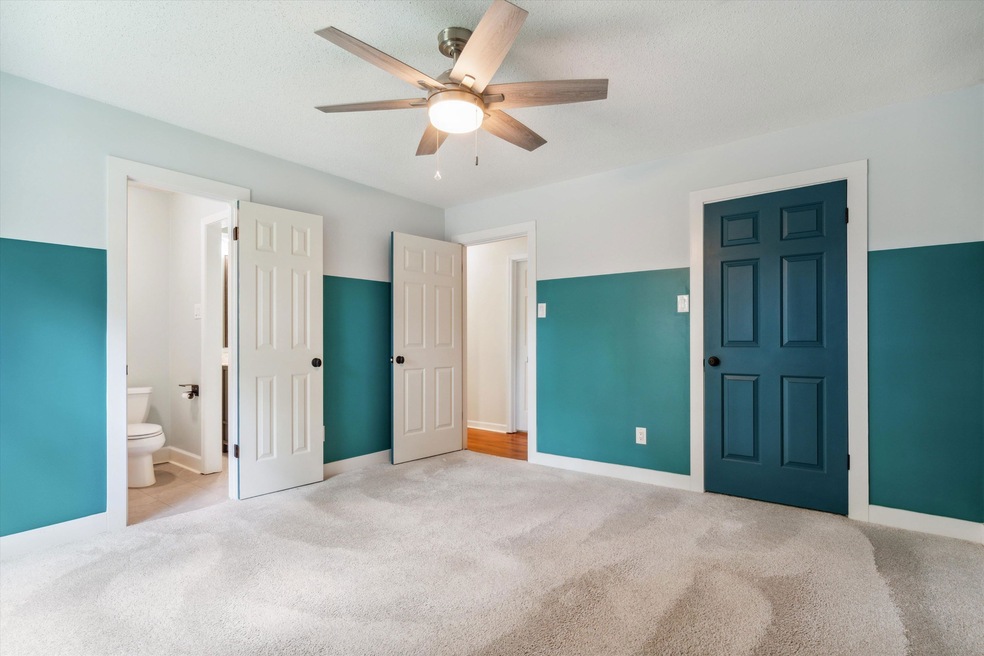 Unfurnished bedroom featuring ensuite bathroom, ca