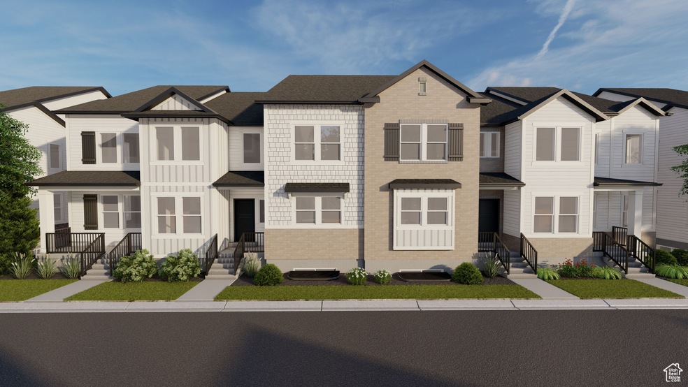 View of front facade featuring board and batten siding, a residential view, and brick siding