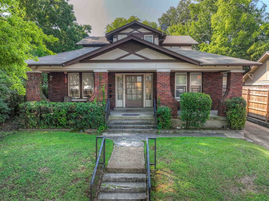 View of front of property with a lawn