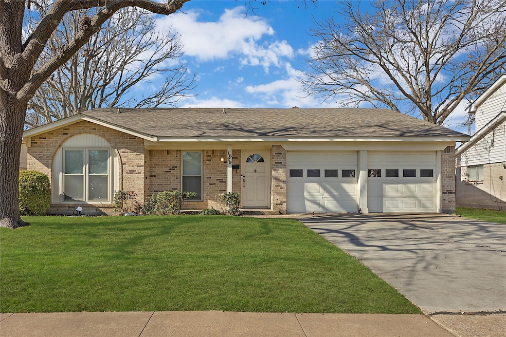 Ranch-style home with a garage and a front yard
