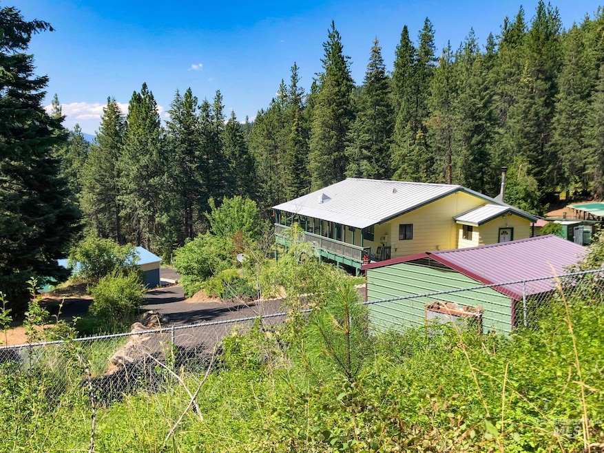 View from above of property featuring a heavily wooded area